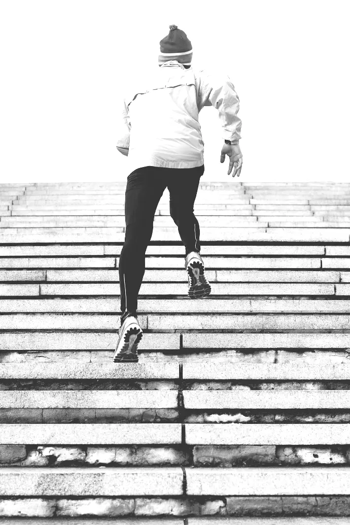 person climbing concrete stairs